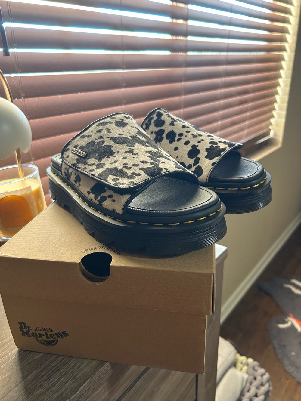 Dr. Martens Black & White Cow Print Slide Sandals